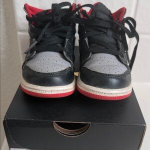 Jordan Kids Black and Gray Sneakers with Red Accents